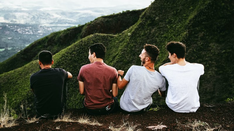 ED Facts - 4 men sitting on mountain cliff